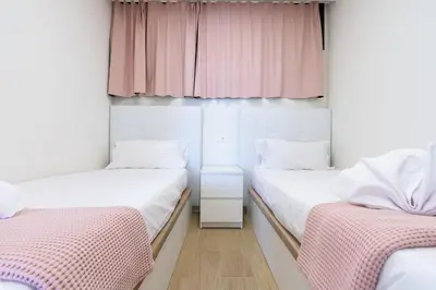 Cama o camas de una habitación en M&M SUITE LOS CACTUS by HOMESTAYGRANCANARIA