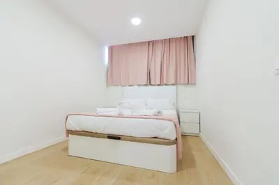 Cama o camas de una habitación en M&M SUITE LOS CACTUS by HOMESTAYGRANCANARIA