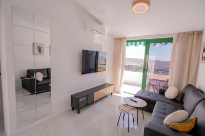 Una televisión o centro de entretenimiento en SOY Puerto Rico Ocean View