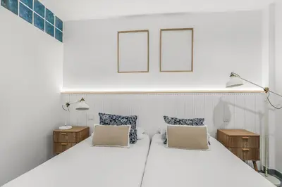 Cama o camas de una habitación en Beachside Comfort Las Canteras