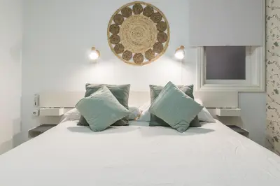 Cama o camas de una habitación en Home2Book Bright&Comfy Apt Near Las Palmas Center