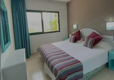 Cama o camas de una habitación en VELEROS SUNSET Puerto Rico Apartement