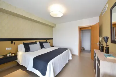 Cama o camas de una habitación en Los Dragos 6 by VillaGranCanaria