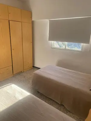 Cama o camas de una habitación en Comfortable and conveniently located house