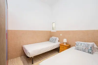 Cama o camas de una habitación en Casa Playa Melenara
