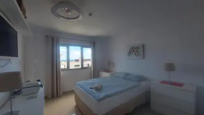 Cama o camas de una habitación en Cayey 2-bedroom Beach Apartment