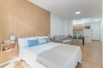 Cama o camas de una habitación en Home2Book Modern Studio in Las Palmas