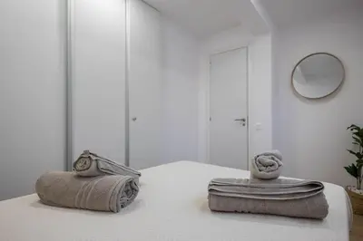 Cama o camas de una habitación en El Bunker Luxury Suite en Playa del Hombre con vista al mar