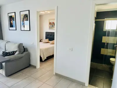 Cama o camas de una habitación en BALCON de AMADORES con vista al océano