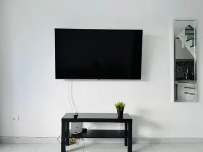 Una televisión o centro de entretenimiento en Bungalow Simone