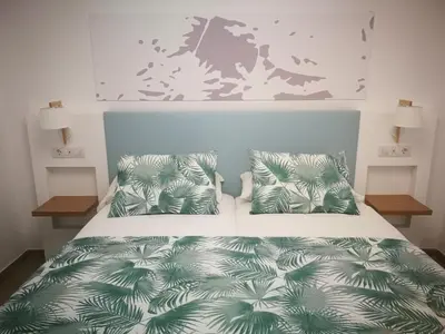Cama o camas de una habitación en Apartamentos Corona Playa