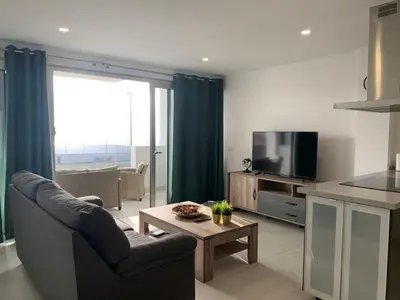 Una televisión o centro de entretenimiento en Sun Paradise