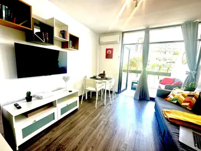 Una televisión o centro de entretenimiento en Beach House by Canarias prime homes