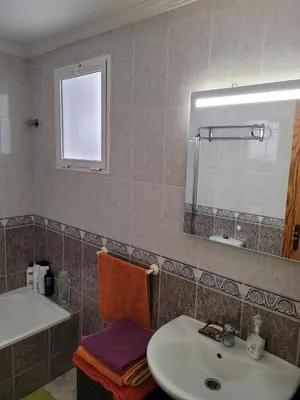 Un baño de Three-bedroom apartment