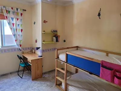 Cama o camas de una habitación en Three-bedroom apartment