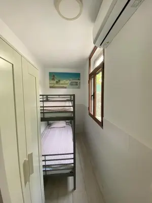Cama o camas de una habitación en Refurbished apartment next to the beach