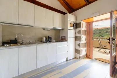 Una cocina o zona de cocina en Quinta Entre Palmeras - Viviendas Vacacionales