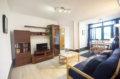 Una televisión o centro de entretenimiento en Gran Canaria Stay Las Olas