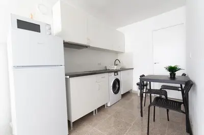 Una cocina o zona de cocina en Piso con Piscina comunitaria