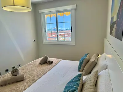Cama o camas de una habitación en Vista Amadores by SunHousesCanarias