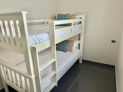 Cama o camas de una habitación en Vista Amadores by SunHousesCanarias