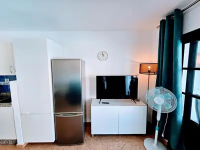 Una televisión o centro de entretenimiento en Eagle View Mar Paraiso