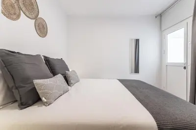 Cama o camas de una habitación en Home2Book Chic Apartment Near The Sea, La Garita