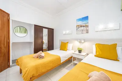 Cama o camas de una habitación en Beach View Apartment II