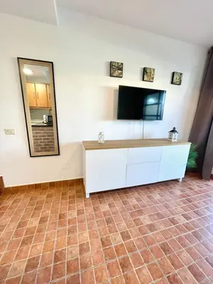 Una televisión o centro de entretenimiento en Paradise Sun & Pool Maspalomas