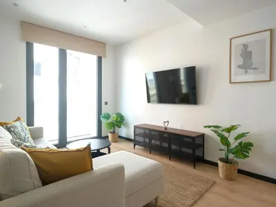 Una televisión o centro de entretenimiento en Apartamento Playa Las Canteras con gimnasio A2D