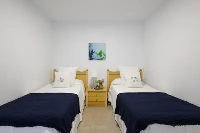 Cama o camas de una habitación en Los Papagayos Beach 1