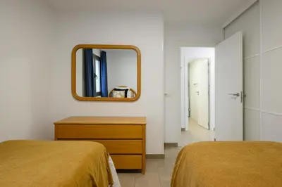 Cama o camas de una habitación en Los Papagayos Beach 1