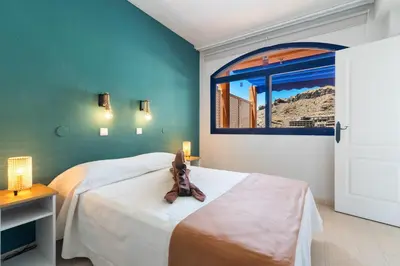 Cama o camas de una habitación en Home2Book Stunning Views Taurito, Terrace & Pool