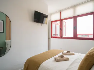 Cama o camas de una habitación en Gran apartamento con ascensor cerca playa Las Canteras BT3A