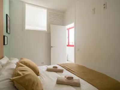 Cama o camas de una habitación en Gran apartamento con ascensor cerca playa Las Canteras BT3A