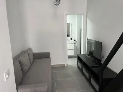 Una televisión o centro de entretenimiento en Nueva LOFT