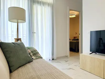 Una televisión o centro de entretenimiento en Las Olas Canarias