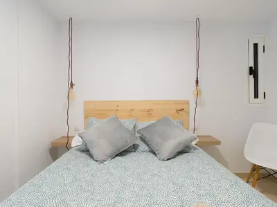 Cama o camas de una habitación en Cozy Nearby Flat Las Canteras