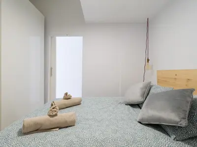 Cama o camas de una habitación en Cozy Nearby Flat Las Canteras
