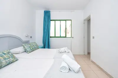 Cama o camas de una habitación en Los Veleros Apartments