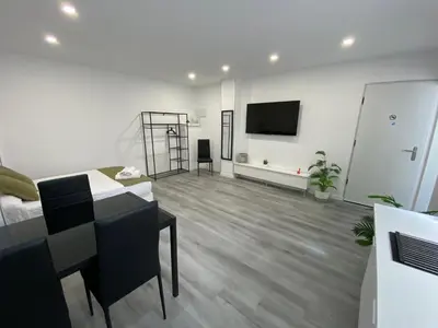 Una televisión o centro de entretenimiento en Loft La Jirafa