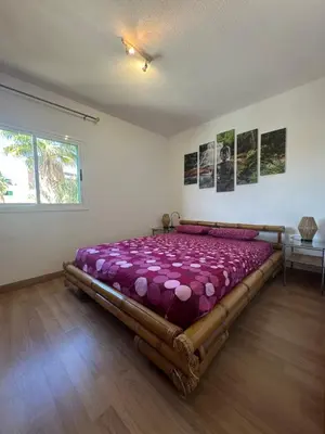 Cama o camas de una habitación en Las olas tropical