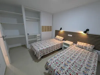 Cama o camas de una habitación en Apartamentos Anau k & L- Playa del inglés - Yumbo