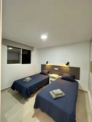 Cama o camas de una habitación en Apartamentos Anau k & L- Playa del inglés - Yumbo