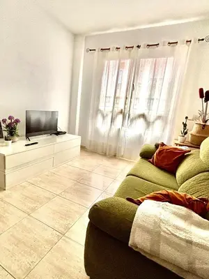Una televisión o centro de entretenimiento en El céntrico apartamento