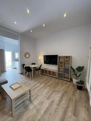 Una televisión o centro de entretenimiento en Casas La Aldea Suites Plaza 3