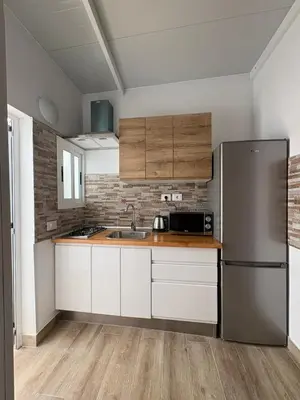 Una cocina o zona de cocina en Casas La Aldea Suites Plaza 3