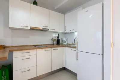 Una cocina o zona de cocina en Charming Apartment with Terrace, Swimming pool and Sea views