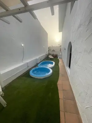 Piscina en o cerca de Suite con terraza y jacuzzi privada en Maspalomas
