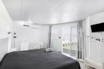 Cama o camas de una habitación en Suite con terraza y jacuzzi privada en Maspalomas